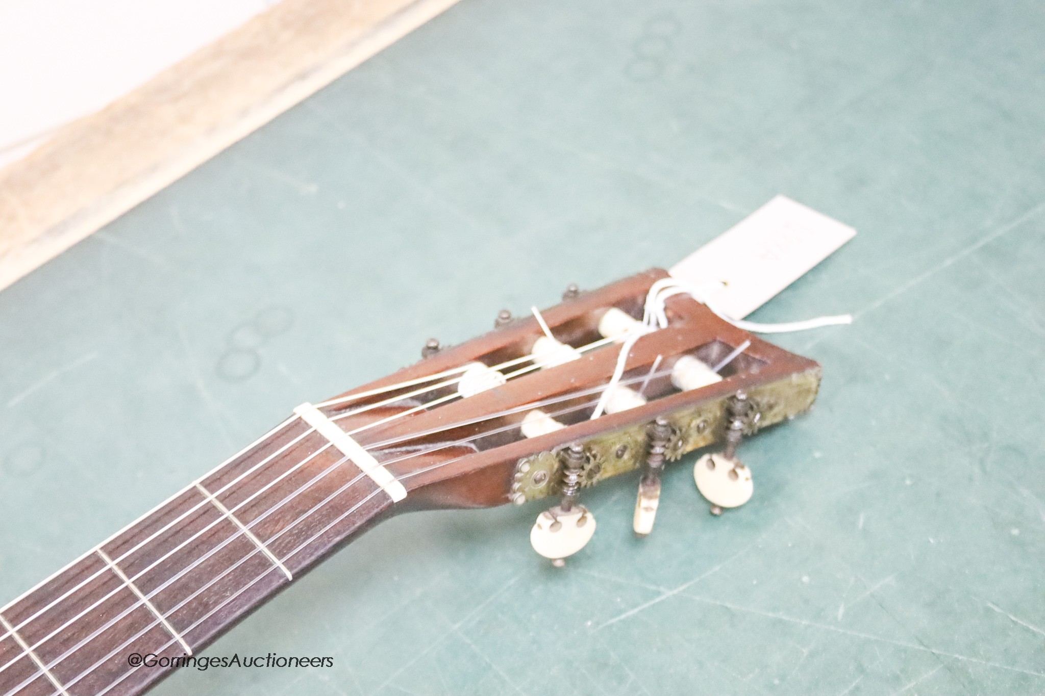 A Victorian parlour guitar, tuning pegs stamped by J. Gerard, 50 King Street, London